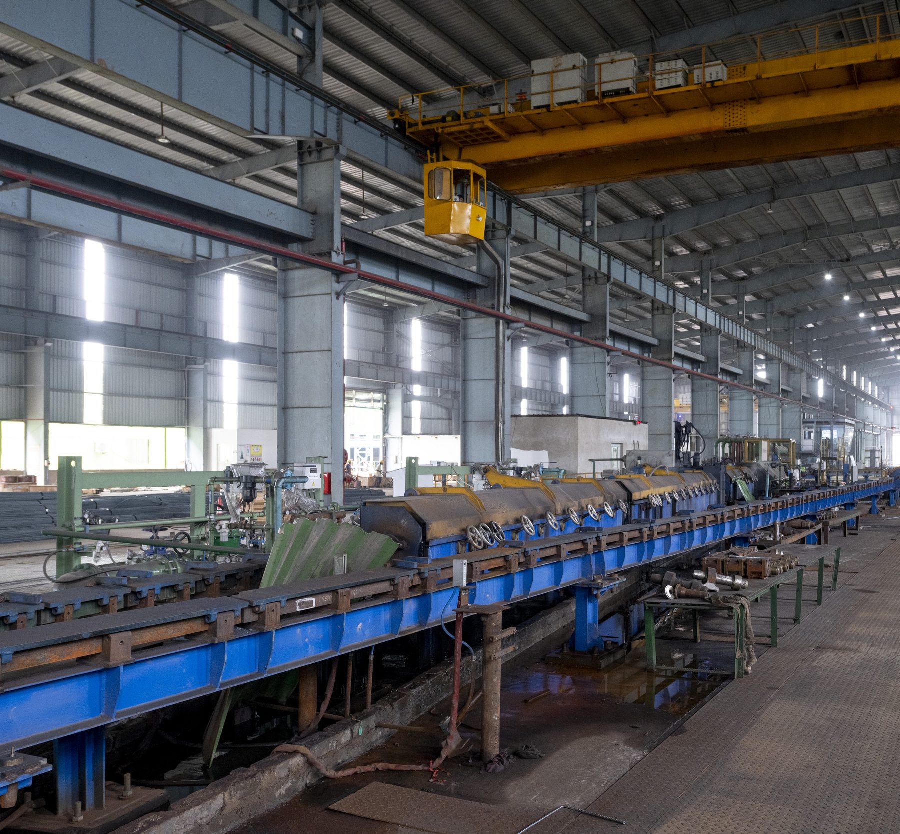The long aisle beside the rolling line inside the mill